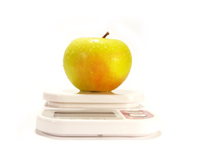 Yellow apple and scale isolared