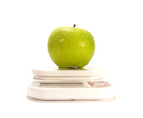 Green apple and scale