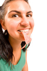 Funny portrait of women with sausage on white background