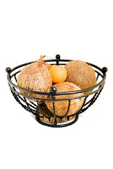 Metal fruit bowl and coconuts