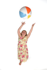 heavy girl catching a beach ball