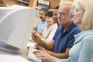 Mature students learning computer skills