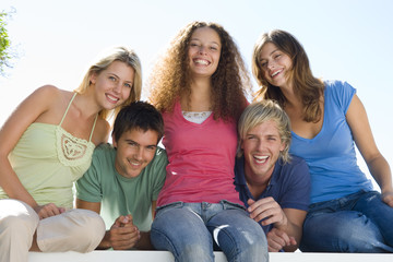 Fototapeta premium Five people on balcony smiling