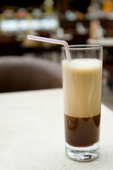 A glass of cold frappuccino in outdoor cafe