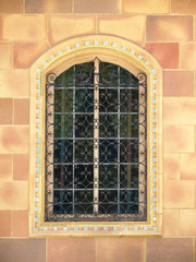 Ornate Window with wrought iron bars
