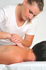 Fototapeta na wymiar back massage at the spa and wellness center