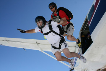 Two Skydivers exit an airplane