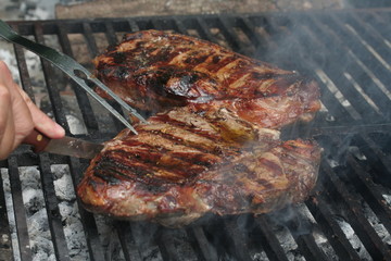 Steak cooking on flame grill