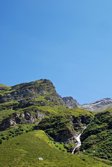 High mountain scene, waterfall, blue sky, Switzerland, Ticino