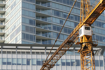 Fototapeta na wymiar Construction Crane and Modern Building