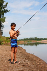 boy fishing with spinning