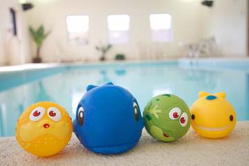 Toys smiling and playing at swimming pool