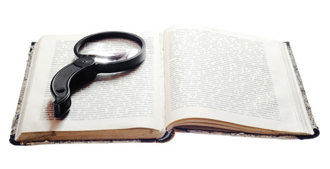 Magnifying Glass On Vintage Book