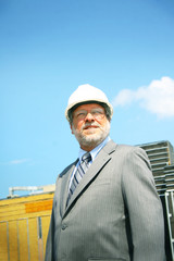 Business man with building in background