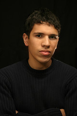 Young Hipanic Man Portrait on Black Background