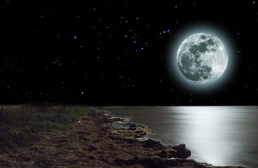 rising of moon above a sea