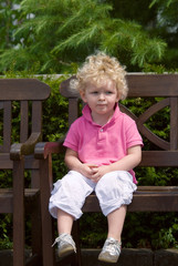 boy sitting on a bench