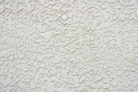 Textured White or Grey Stucco Wall With Small Crack