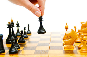 Chessplayer making a move on a chessboard