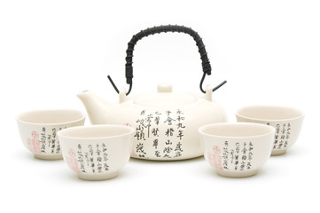 Tea-pot and cups on white background