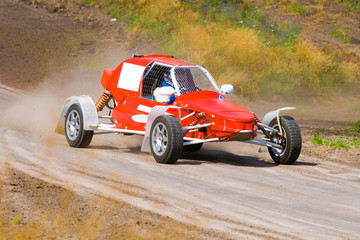 Red racing buggy on track