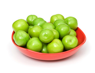 Green plums isolated on the white background