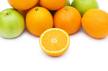 Apple and oranges isolated on the white background