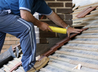Close-up of trainee roofer on mock roof top - 8785126