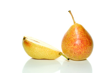 Whole yellow-red pear and half isolated on the white background