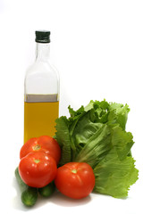 olive oil with green salad and tomatoes