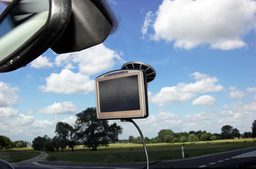 GPS on car window over blue sky - 8786701