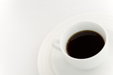 White coffee cup over a white background