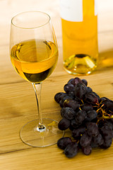 White wine glass with bottle