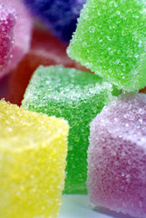 Colorful sugar jelly cubes closeup