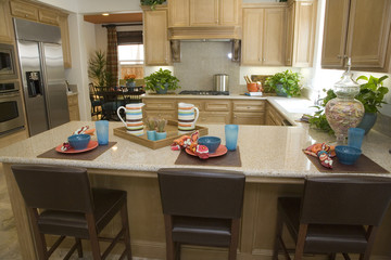 Luxury kitchen with a granite breakfast counter.