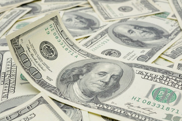 Close up of wavy US one hundred dollar bills