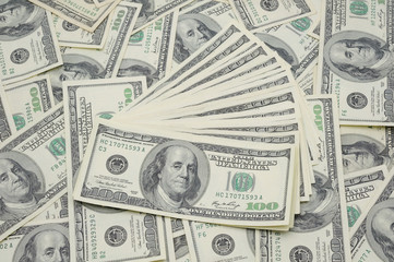 Fanned out US one hundred dollar bills