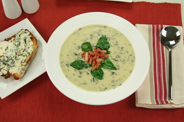 Creamy spinach soup with crispy bacon and blue cheese toast.