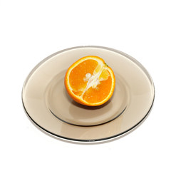 Naklejka na ściany i meble Orange segments on the plate isolated on white.