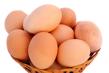 eggs in a basket a over white background