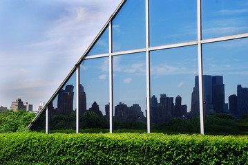 urban landscape in glass wall reflection in new york