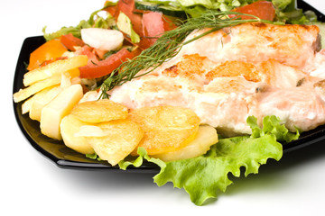 Stake from a salmon with vegetables