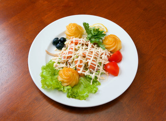 The Italian salad with olives and a liver.Italian kitchen