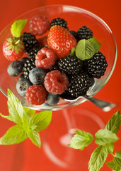 mixed berry fruit in a glass close up