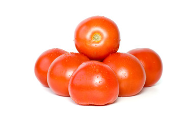 Pile of tomatoes with waterdrops isolated on the white