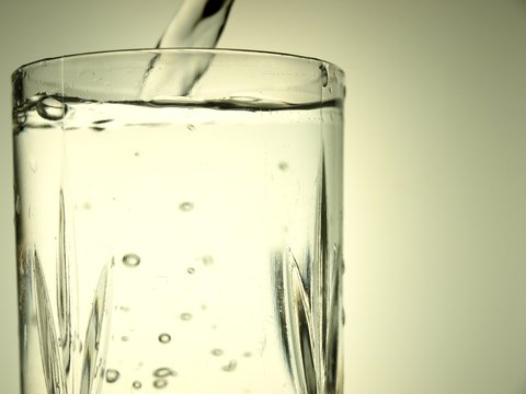 Pouring Water Into a Glass