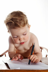 Baby girl on white background with pen