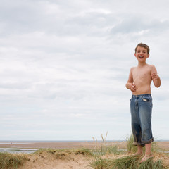 who needs sun anyway? very dirty and very happy little boy