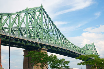Jacques Cartier bridge crossing Saint Lawrence river in Montreal