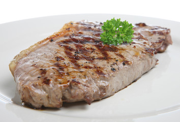 Seasoned sirloin steak garnished with parsley